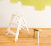 Step
                                ladder and bucket of paint in a home in
                                NYC